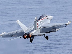 This handout photo taken on June 5, 2016 and released by the US Navy on June 16, 2016 shows a Boeing EA-18G Growler electronic warfare aircraft taking off from the USS John Stennis aircraft carrier at sea in the Indo-Asia-Pacific region.