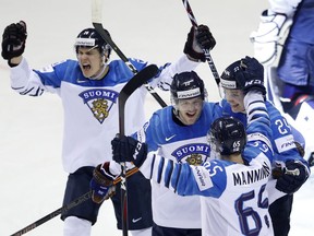 Finland's Niko Ojamaki, 2nd let, celebrates with teammates after scoring his sides second goal during the Ice Hockey World Championships group A match between the United States and Finland at the Steel Arena in Kosice, Slovakia, Monday, May 13, 2019.
