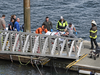 Emergency response crews transport an injured passenger to an ambulance at the George Inlet Lodge docks, May 13, 2019, in Ketchikan, Alaska. The passenger was from one of two float planes reported down in George Inlet early Monday.