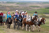 Prime Minister Justin Trudeau arrives with other dignitaries by horse and wagon prior to the exoneration of Chief Poundmaker on the Poundmaker First Nation, May 23, 2019.