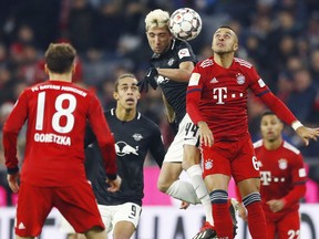 File---Picture taken Dec.19, 2018 shows Leipzig's Kevin Kampl, left, and Bayern's Thiago challenging for there ball during the German Bundesliga soccer match between FC Bayern Munich and RB Leipzig in Munich, Germany.