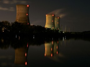 FILE - In this Nov. 2, 2006, file photo, cooling towers of the Three Mile Island nuclear power plant are reflected in the Susquehanna River in this image taken with a slow shutter speed in Middletown, Pa. The owner of Three Mile Island, site of the United States' worst commercial nuclear power accident, is acknowledging in a Wednesday, May 8, 2019 statement that it is unlikely to get a financial rescue from Pennsylvania and says it plans to go through with a shutdown starting June 1.