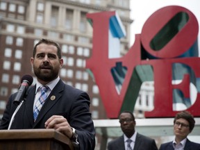FILE - In this Sept. 25, 2014, file photo, State Rep. Brian Sims, D-Philadelphia, accompanied by other officials, speaks at a protest calling on Pennsylvania to add sexual orientation to its hate crime law at John F. Kennedy Plaza, also known as Love Park in Philadelphia. The Democratic Pennsylvania state lawmaker is drawing criticism for recording himself berating a woman demonstrator at length outside an abortion clinic in Philadelphia, calling her an "old white lady" and her protest "grotesque."