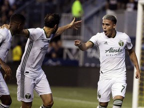 Portland Timbers' Brian Fernandez, right, reacts after scoring a goal during the first half of an MLS soccer match against the Philadelphia Union in Chester, Pa., Saturday, May 25, 2019.
