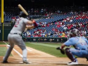 Fans view St. Louis Cardinals' Paul DeJong at bat and Philadelphia Phillies catcher Andrew Knapp during the first inning of a baseball game, Thursday, May 30, 2019, in Philadelphia.