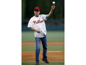 Actor Bruce Willis throws out a first pitch before a baseball game between the Philadelphia Phillies and the Milwaukee Brewers, Wednesday, May 15, 2019, in Philadelphia.