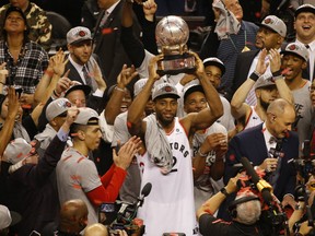 Toronto Raptors Kawhi Leonard raises the Larry O'Brien trophy as they are the Eastern Conference champions  in Toronto, Ont. on Saturday May 25, 2019.