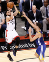 Toronto Raptor Fred VanVleet shoots over Klay Thompson of the Golden State Warriors during Game 1 of the NBA Finals.