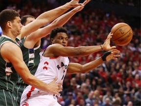 Kyle Lowry passes the ball during the second half against the Milwaukee Bucks in game three of the NBA Eastern Conference Finals at Scotiabank Arena on May 19, 2019 in Toronto.