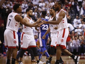 Toronto Raptors Kawhi Leonard SF (2) with Fred Van Vleet and Kyle Lowry during the second half in Toronto, Ont. on Saturday April 27, 2019.
