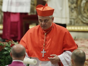 FILE - In this Thursday, June 28, 2018 filer, Cardinal Konrad Krajewski right after being elected in a consistory in St. Peter's Basilica at the Vatican. Pope Francis' almsgiver has gone down a Rome manhole to restore electricity for hundreds of homeless people living in an unused state-owned building. Polish Cardinal Konrad Krajewski told Italian news agency ANSA he went underground and flipped a power switch Saturday in a "desperate gesture" to help the building's more than 400 occupants .