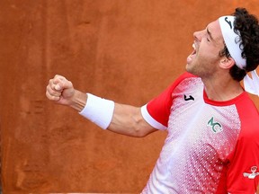 Marco Cecchinato of Italy celebrates after winning his men's singles first round match against Alex de Minaur of Australia, at the Italian Open tennis tournament in Rome, Italy, Monday, May 13, 2019.