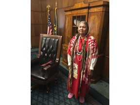 In this May 16, 2019 photo, Patricia Whitefoot, a member of the Yakama tribe from White Swan, Washington, poses for a photo in the state house in Salem, Ore. after Gov. Kate Brown signed a bill directing the state police to study how to improve criminal justice resources to solve cases of Native American women who have gone missing or been killed. Whitefoot's sister Daisy disappeared in 1987. The case was never solved. Whitefoot was involved in the effort to pass the bill in Oregon, and a similar one in Washington state earlier.
