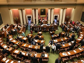 Representatives gather on the floor of the Minnesota House in the state Capitol in St. Paul, Minnesota, on Friday, May 24, 2019, on the opening day of a special session to finish work on the state's $48 billion two-year budget.