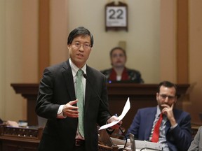 State Sen. Richard Pan, D-Sacramento, left, calls on lawmakers to approve his measure to toughen the rules for vaccination exemptions Wednesday, May 22, 2019, in Sacramento, Calif. The Senate approved the bill, SB276, that gives state public health officials instead of local doctors the power to decide which children can skip their shots before attending school.