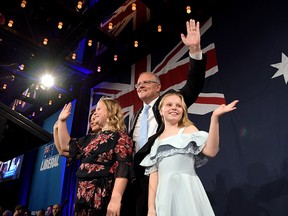 Prime Minister of Australia and leader of the Liberal Party, Scott Morrison, flanked by his wife, Jenny Morrison, and daughters Lily and Abbey, delivers his victory speech in Sydney on May 18, 2019.