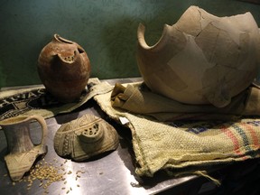 Ancient jars are on display during a press conference in Jerusalem, Wednesday, May 22, 2019. Israeli researchers celebrated Wednesday a long-brewing project of making beer and mead using yeasts extracted from ancient clay vessels -- some over 5,000 years old. Archaeologists and microbiologists teamed up to study yeast colonies found in microscopic pores in pottery fragments. The shards were found at Egyptian, Philistine and Judean archaeological sites in Israel spanning from 3,000 BC to the 4th century BC.