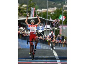 Italy's Fausto Masnada celebrates as he crosses the finish line to win the sixth stage of the Giro D'Italia, tour of Italy cycling race, from  Cassino to San Giovanni Rotondo, Thursday, May 16, 2019.