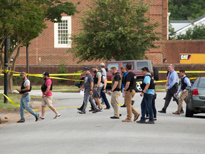 Police work the scene where 12 people were killed during a mass shooting at the Virginia Beach city public works building, May 31, 2019 in Virginia Beach, Va.