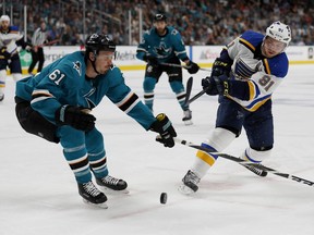 San Jose Sharks' Justin Braun (61) battles for the puck against St. Louis Blues' Vladimir Tarasenko (91) in the second period in Game 1 of the NHL hockey Stanley Cup Western Conference finals in San Jose, Calif., on Saturday, May 11, 2019.