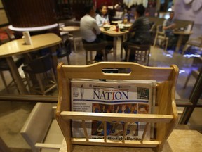 Thailand's English newspaper The Nation is displayed in a cafe in a hotel in Bangkok, Thailand, Thursday, May 16, 2019. The management of The Nation - founded in 1971 and one of Thailand's two English language dailies _ said that due to falling revenues, the publication of the printed paper edition of the newspaper will cease by the end of June, but it will continue to be published only online.