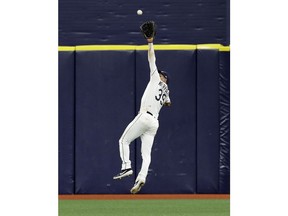 Tampa Bay Rays center fielder Kevin Kiermaier makes a leaping catch on a flyout by Arizona Diamondbacks' Carson Kelly during the fifth inning of a baseball game, Tuesday, May 7, 2019, in St. Petersburg, Fla.