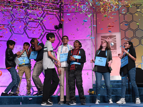 The eight co-champions of the 2019 Scripps National Spelling Bee celebrate their victory.