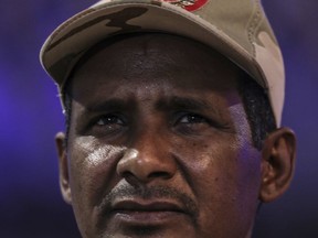 In this Saturday, May 18, 2019 photo, Gen. Mohammed Hamdan Dagalo, better known as Hemedti, the deputy head of the military council that assumed power in Sudan after the overthrow of President Omar al-Bashir, speaks to journalists in Khartoum, Sudan. At 44, he is the youngest member of the council. He says he refused orders from al-Bashir to fire on the protesters, and he praised them as recently as last weekend. (AP Photo)