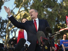 Australian Labour Party leader Bill Shorten, center, speaks to volunteers during a community barbecue in Adelaide, Australia Tuesday, May 14, 2019. A federal election will be held in Australian on Saturday, May 18, 2019.