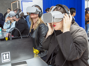 Participants check out the virtual reality display at the C2 technology conference May 22, 2019 in Montreal. Thousands of technologists converged on Canada this week for the C2, and the Collision conference in Toronto.