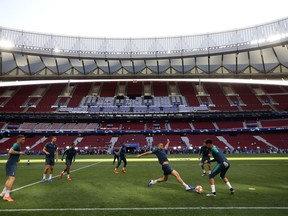 Tottenham's Eric Dier lunges for the ball during a training session at the Wanda Metropolitano stadium in Madrid, Friday May 31, 2019. English Premier League teams Liverpool and Tottenham Hotspur are preparing for the Champions League final which takes place in Madrid on Saturday night.