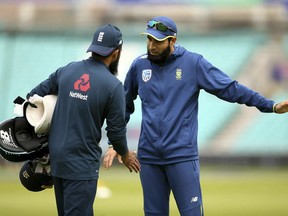 England's Adil Rashid, left, and South Africa's Imran Tahir in discussion during a training session at The Oval, London, Wednesday May 29, 2019 on the eve of the opening match of the Cricket World Cup.