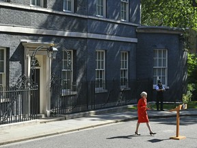 Britain's Prime Minister Theresa May arrives to make a statement outside at 10 Downing Street in London, Friday May 24, 2019. Theresa May says she'll quit as UK Conservative leader on June 7, sparking contest for Britain's next prime minister.