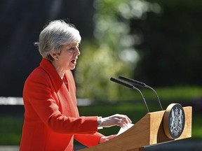 Britain's Prime Minister Theresa May makes a statement outside at 10 Downing Street in London, Friday May 24, 2019. Theresa May says she'll quit as UK Conservative leader on June 7, sparking contest for Britain's next prime minister.