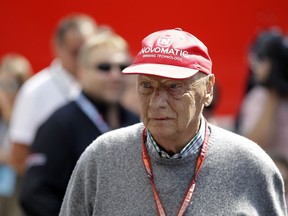 FILE - In this July 7, 2018, file photo, former Formula One World Champion Niki Lauda of Austria walks in the paddock before the third free practice at the Silverstone racetrack, Silverstone, England. Three-time Formula One world champion Niki Lauda, who won two of his titles after a horrific crash that left him with serious burns and went on to become a prominent figure in the aviation industry, has died. He was 70. The Austria Press Agency reported Lauda's family saying in a statement he "passed away peacefully" on Monday, May 20, 2019.