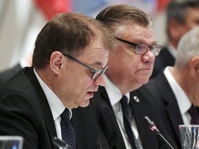 Finnish Prime Minister Juha Sipil', left, and  Foreign Minister Timo Soini attend at the Ministers for Foreign Affairs of the Council of Europe's annual meeting in Helsinki, Finland Friday, May 17, 2019.