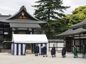 In this photo released by Imperial Household Agency of Japan, an imperial turtle-shell divination rite is held at the Imperial Palace in Tokyo Monday, May 13, 2019. Japanese palace officials have used an ancient turtle-shell divination to choose sites to harvest sacred rice used in an upcoming annual ritual, the most important one new Emperor Naruhito will perform after enthronement. (Imperial Household Agency of Japan via AP)