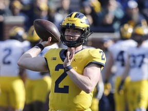 In this April 13, 2019, photo, Michigan quarterback Shea Patterson throws during the Michigan's annual spring NCAA college football game in Ann Arbor, Mich. A string of recent high-profile transfers gave the college football world the impression it was getting easier for players to switch schools and compete right away. Patterson to Michigan, Justin Field to Ohio State and Tate Martell to Miami seemed to usher in a new era of free agency, but waiver approvals are still far from a sure thing. That is prompting athletes, coaches and others to complain about a process that can be somewhat mysterious.