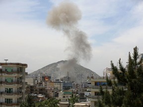 Smokes rises after a huge explosion near the offices of the attorney general in Kabul, Afghanistan, Wednesday, May 8, 2019. Two police officials say Wednesday's explosion was followed by a gunbattle between militants and security forces.