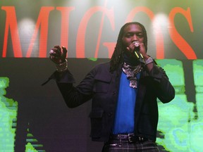 FILE - In this Feb. 1, 2019, file photo, Offset of Migos performs onstage at the Capitol Records Super Bowl Party at the Masquerade, in Atlanta. Authorities say Offset is facing a felony charge of criminal damage to property after an incident with a fan at a suburban Atlanta retailer. The Atlanta Journal-Constitution reports Sandy Springs Police confirm an arrest warrant was issued for the rapper, whose real name is Kiari Cephus. The report says the rapper's accused of knocking a cellphone out of a fan's hands as the fan recorded him recently at a Target store.