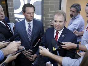 House Republican Majority Leader William Lamberth, R-Portland, center right, and Rep. Cameron Sexton, R-Crossville, center left, speak after the House Republican Caucus met to discuss the future of House Speaker Glen Casada, who is ensnarled in a texting scandal, Monday, May 20, 2019, in Nashville, Tenn. The caucus returned a 45-24 vote of no confidence for Casada.