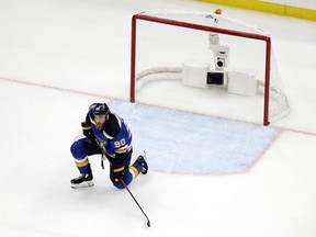 St. Louis Blues center Ryan O'Reilly (90) kneels by the net after the San Jose Sharks tied the game late in the third period of Game 3 of the NHL hockey Stanley Cup Western Conference final series Wednesday, May 15, 2019, in St. Louis. The goal sent the game into overtime.