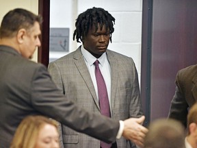 FILE - In this May 20, 2019, file photo, Emanuel Kidega Samson, 27, center, enters the courtroom in Nashville, Tenn. Samson, accused of fatally shooting one person and wounding seven others in a Nashville church in 2017, said Wednesday, May 22, he can't remember if he did it.