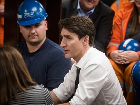 Prime Minister Justin Trudeau speaks with employees at Stelco in Hamilton, Ont., on Friday, May 17, 2019.