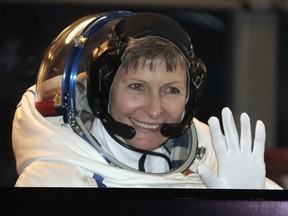 In this Nov. 17, 2016 photo, U.S. astronaut Peggy Whitson, member of the main crew of the expedition to the International Space Station (ISS), gestures from a bus prior the launch of Soyuz MS-3 space ship at the Russian leased Baikonur cosmodrome, Kazakhstan.