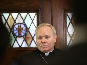 Dallas Bishop Edward J. Burns speaks to members of the media following a police raid on several Diocese of Dallas offices, Wednesday, May 15, 2019, at Holy Trinity Catholic Church in Dallas. A police commander says a search at the Catholic Diocese of Dallas began when an investigation into child sexual abuse allegations against a former priest uncovered claims against others.
