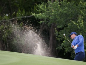 Brooks Koepka takes a shot from a bunker on the 15th hole during the second round of the Bryon Nelson golf tournament Friday, May 9, 2019, at Trinity Forest in Dallas.