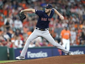 Boston Red Sox starting pitcher Chris Sale throws during the first inning of a baseball game against the Houston Astros Friday, May 24, 2019, in Houston.
