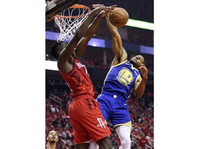 Houston Rockets center Clint Capela, left, blocks the shot of Golden State Warriors guard Andre Iguodala during the first half of Game 3 of a second-round NBA basketball playoff series, Saturday, May 4, 2019, in Houston.