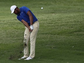 Tony Finau hits from the rough on the 18th hole  during the first round of the Charles Schwab Challenge golf tournament at Colonial Country Club in Fort Worth, Texas, Thursday, May 23, 2019.